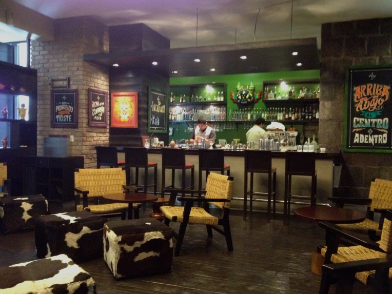 bar with artwork and statues - Panchita // A Slice of Peru